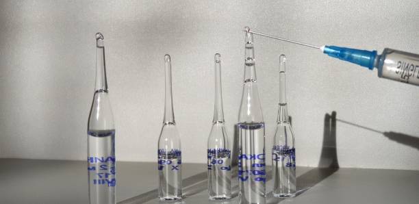 istock Medicine and syringe. Syringe with medicine. 1128504059