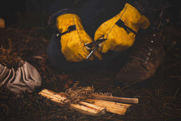 istock Fire Shooter with Rod and Knife Burn Fire in Forest 1128505157