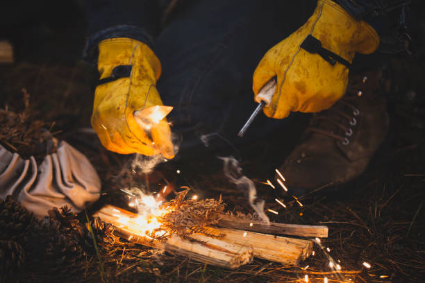 istock Fire Shooter with Rod and Knife Burn Fire in Forest 1128505158
