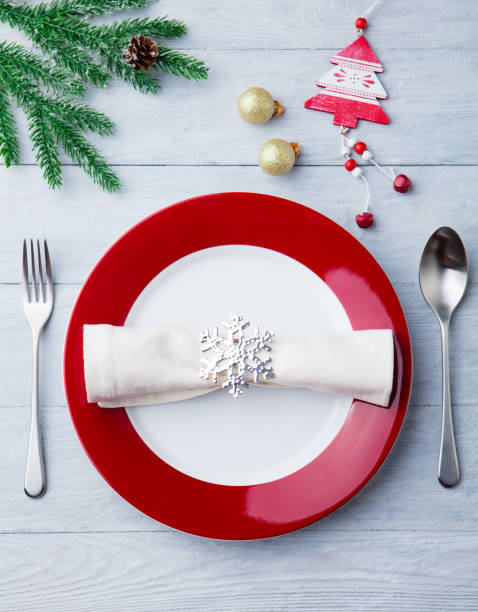istock Christmas, New Year celebration place table setting. Wooden background. Top view. 1128505287