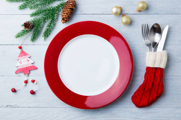 istock Christmas, New Year celebration place table setting. Wooden background. Copy space. Top view. 1128507838