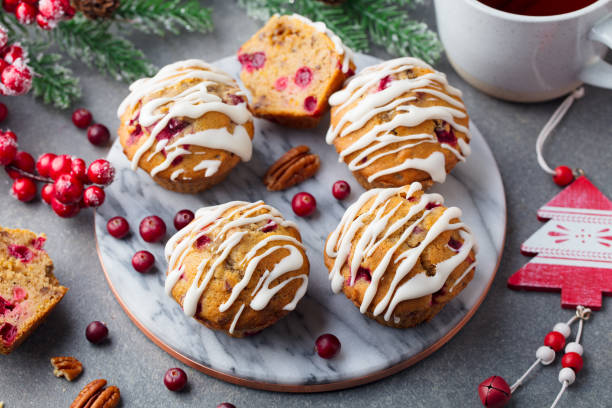istock Muffins, cakes with cranberry and pecan nuts. Christmas decoration. Top view. 1128508046