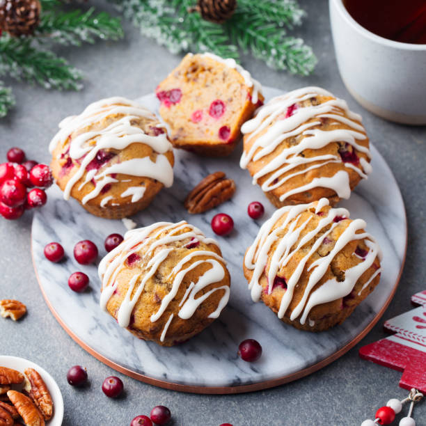 istock Muffins, cakes with cranberry and pecan nuts. Christmas decoration. Top view. 1128508945
