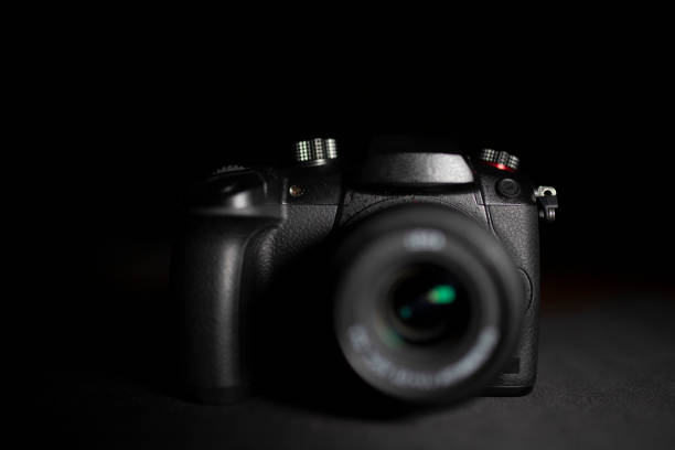 istock Photo camera isolated on black background 1128509115