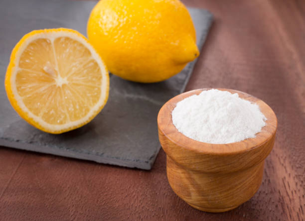 istock Lemon and baking soda on wooden table 1128509446