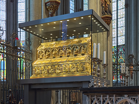 Cologne, Germany - December 10, 2018: Shrine of the Three Kings (Tomb of the Three Magi) in Cologne Cathedral. Traditionally believes that it contain the bones of the Biblical Magi. The shrine were designed by the famous medieval goldsmith Nicholas of Verdun, who began work on it in 1180 or 1181. The Cologne Cathedral is Germany's most visited landmark, attracting an average of 20,000 people a day, which corresponds to seven to eight million a year. Entrance to the cathedral is free.
