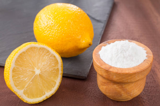 istock Lemon and baking soda on wooden table 1128510773