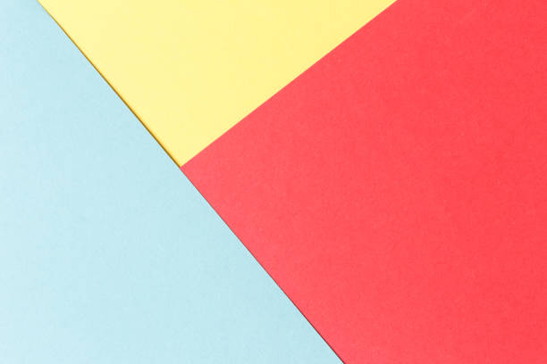 istock Abstract geometric festive background: red, yellow, blue. Paper background top view, minimalistic concept. 1128511985