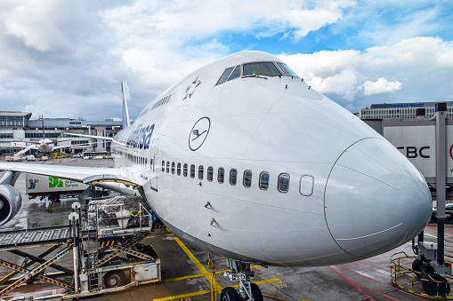 Frankfurt, Germany - February 12, 2018: View from the departure gate at Frankfurt Airport (FRA) onto a Boeing 747-400 aircraft of Lufthansa, which is being prepared for departure to Dubai.