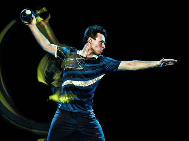istock handball player young man isolated speed light painting 1128514701