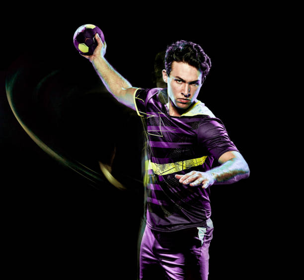 istock handball player young man isolated speed light painting 1128514930