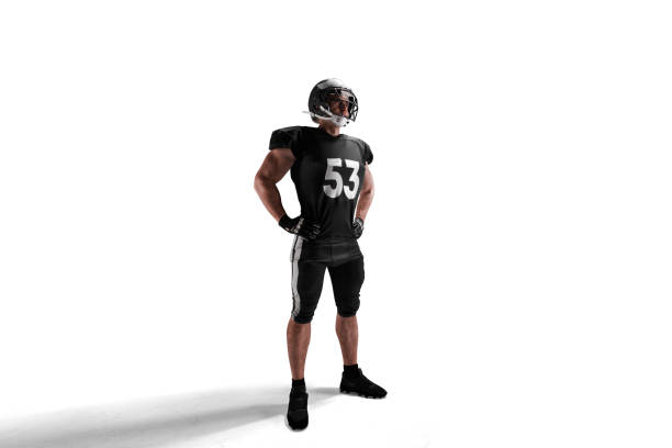 American football isolated on white American football american football player studio stock pictures, royalty-free photos & images