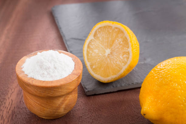 istock Lemon and baking soda on wooden table 1128515089
