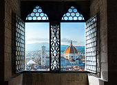 View from the old window on Florence Duomo Basilica di Santa Maria del Fiore.  Florence, Italy. Collage of the historical theme and the theme of travel.