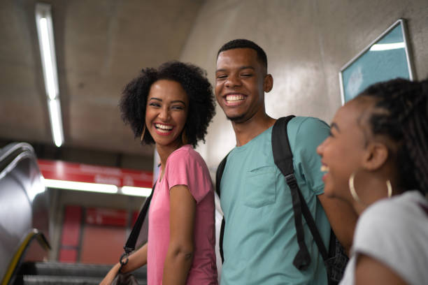 istock Afro young friends in the metro 1128516262