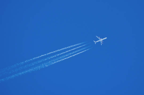 istock Jet aircraft flying at high altitude with contrails. 1128519468