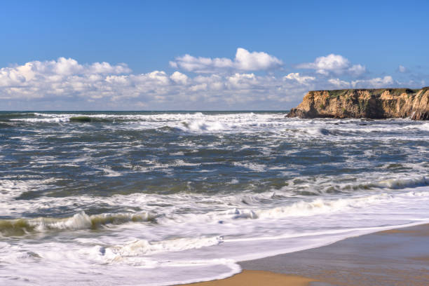 istock Turbulent Ocean Waves On Beach Off California Coast 1128522760