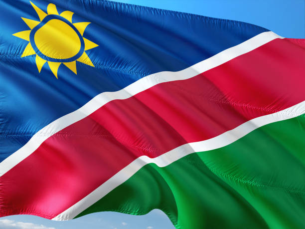istock Flag of Namibia waving in the wind, isolated white background. 1128525791