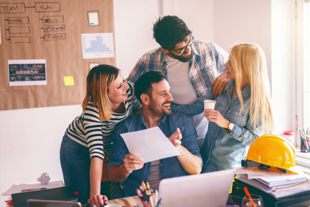 istock Smiling successful business people developing business plan. Start up business concept. 1128527477