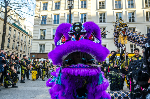Paris, France; 05 February 2019: Celebration of the Chinese New Year in Paris. A group of Chinese residents performs a parade with dragons and typical dances to celebrate the arrival of a new year