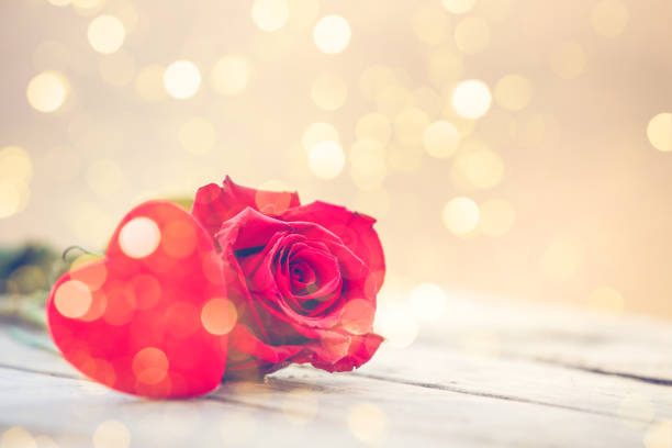 istock Red heart and rose St Valentine background 1128531967