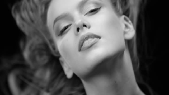 Beautiful woman with natural make-up. Perfect fashion models face. Black & White fashion video. 4K 30fps ProRes 4444
