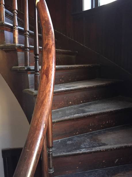 istock Gorgeous old wooden spiral staircase section 1128539803