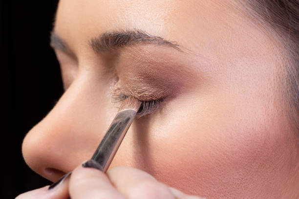istock Girl putting mascara on eyelashes.beauty make up 1128543688