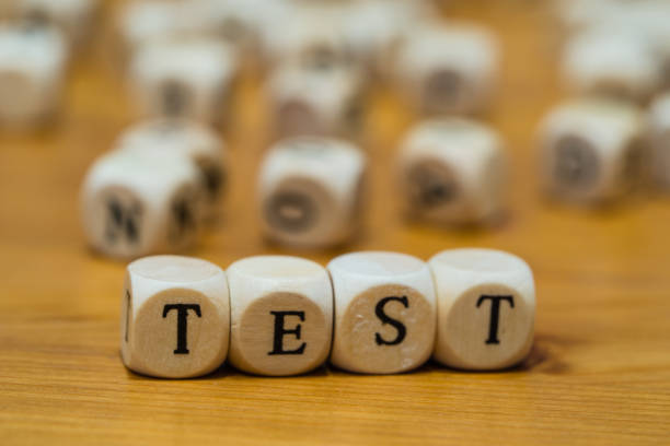 istock Test written with wooden cubes in German 1128543735