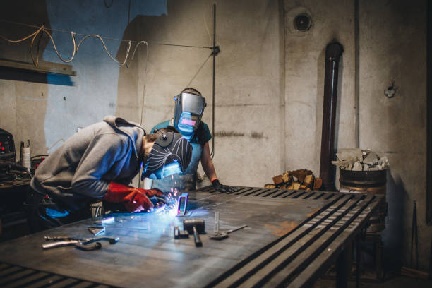 istock Coworkers in a factory working together 1128546705