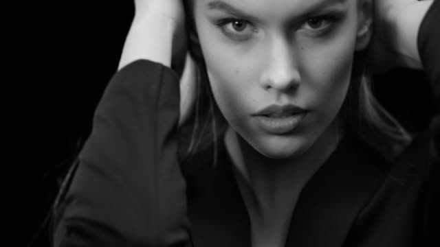 Beautiful woman with natural make-up. Perfect fashion models face. Black & White fashion video. 4K 30fps ProRes 4444