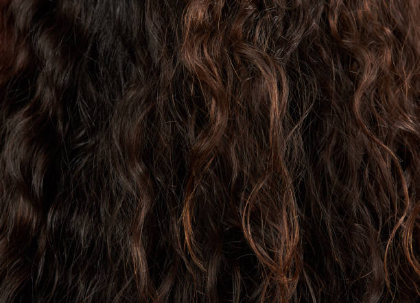 istock Dark brown woman hair texture 1128546983