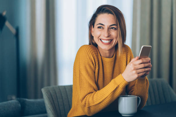 texting at home - people joy relaxation concentration imagens e fotografias de stock