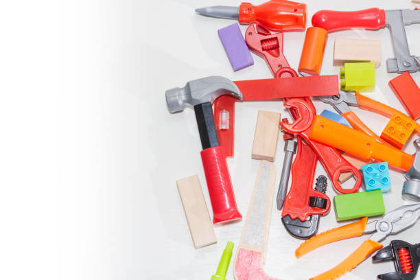 istock Toy tools and cubes on a light background. Toy for children 1128547688