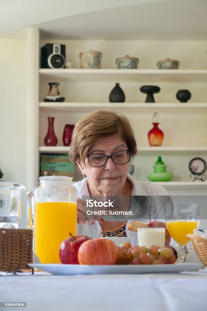 Old woman having breakfast 80 years old
Alone, in an apartment Mace - Club Stock Photo