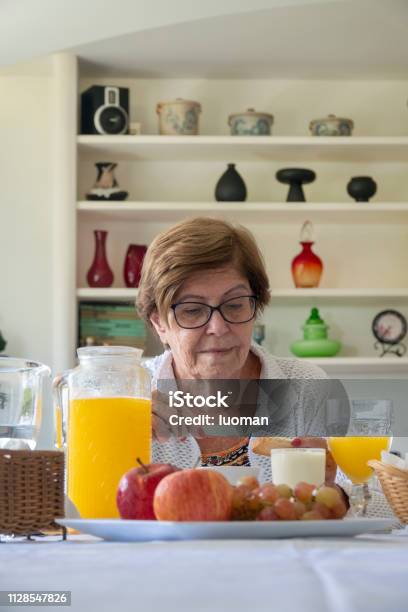 Old Woman Having Breakfast Stock Photo - Download Image Now - Mace - Club, Eating, Cheese