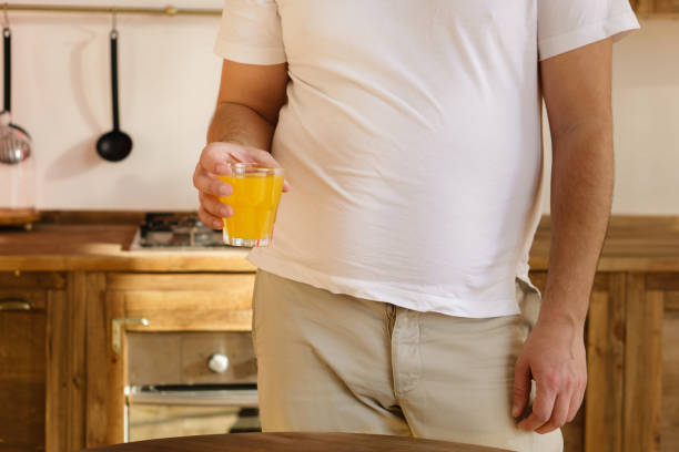 istock sugar contain, vitamin beverage, orange juice 1128553376