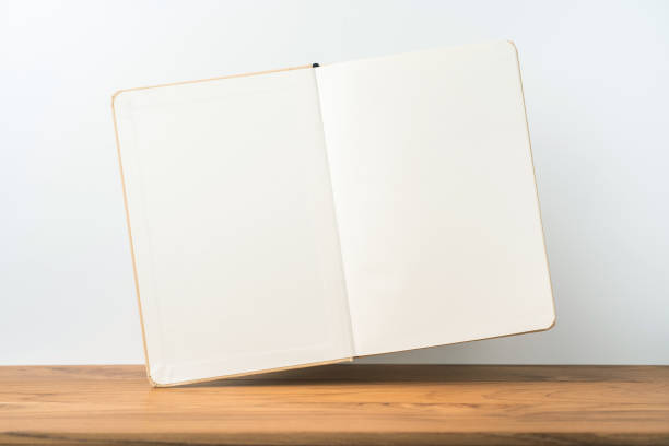 istock Perspective view of kraft notebook on wood floor 1128555566