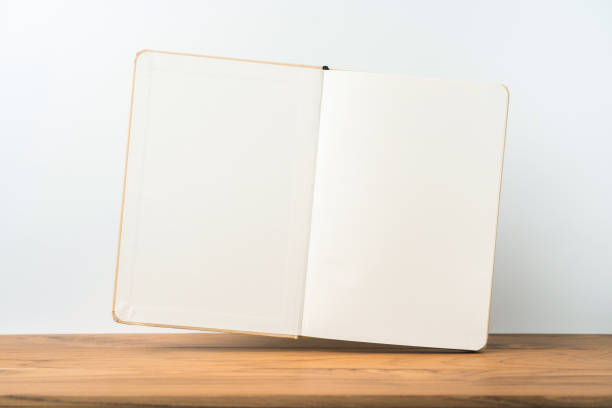 istock Perspective view of kraft notebook on wood floor 1128555580