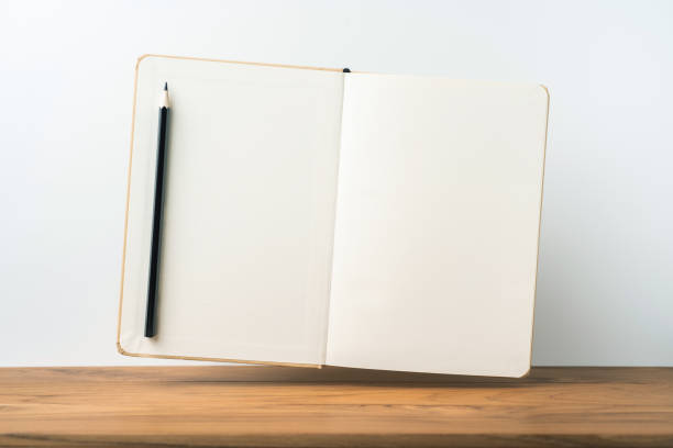 istock Perspective view of kraft notebook on wood floor 1128555595
