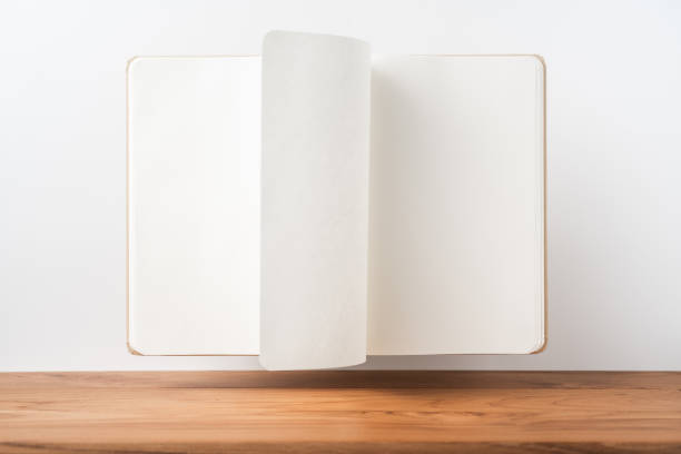 istock Perspective view of kraft notebook on wood floor 1128556923