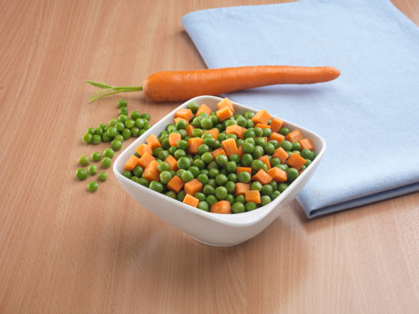 istock Mixture vegetables ,potato and carrot with green pea 1128561232