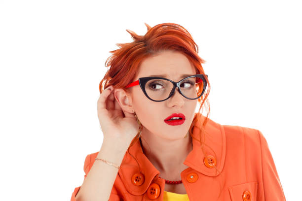 istock Woman listening with her hand on an ear isolated over white background 1128564485