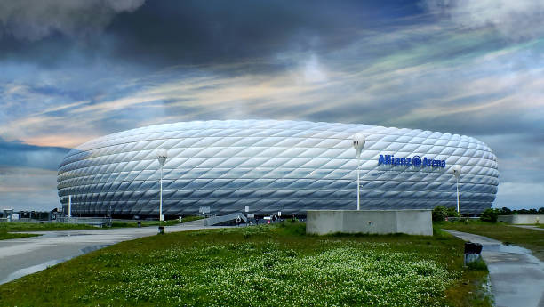 Allianz Arena Munich Munich, Germany - March 28, 2014: Exterior view of Allianz Arena football stadium, home stadium of FC Bayern Munich. The facade is constructed of 2,874 foil air panels. Build 2005 for 66.000 people. allianz arena stock pictures, royalty-free photos & images