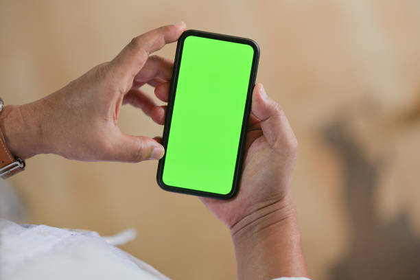 istock Top view of Man standing and using mobile smart phone 1128567517
