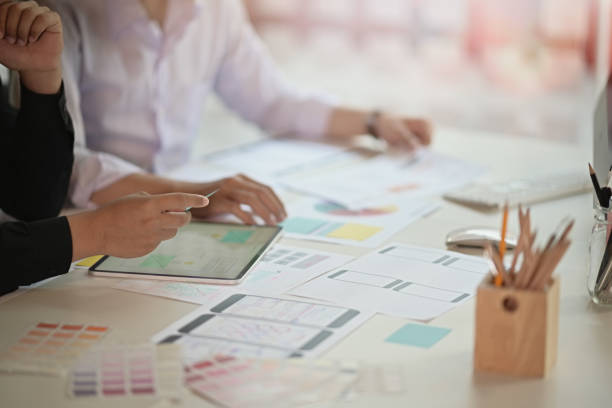 istock Cropped shot of team designers drawing website UX UI app development 1128567530