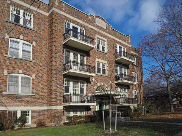 Photo of small old fashioned brick apartment building