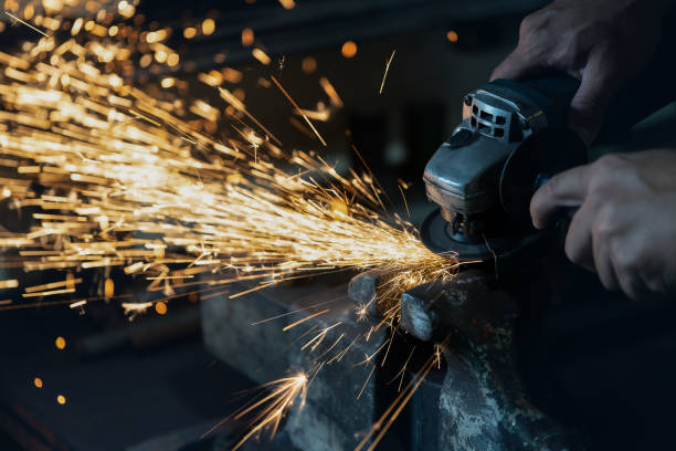 istock Technicians are grinding steel in the factory. 1128573480