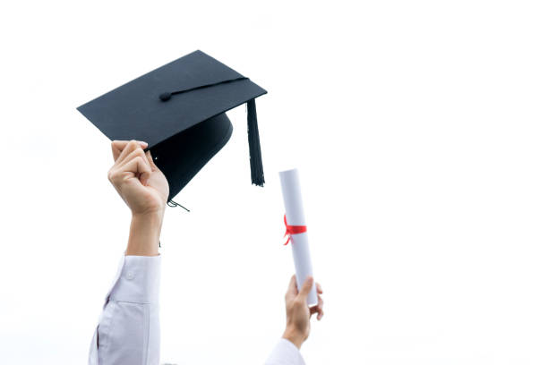 istock young man wear cap and gown graduation suit 1128578242
