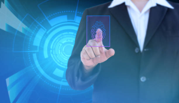 istock businessman scan fingerprint for biometric authentication and blue hi-tech background - can use to display or montage on product 1128578281